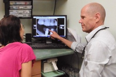 Dr. Olmstead Reviewing X-Ray Dr. Olmstead Reviewing X-Ray